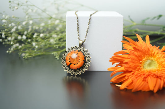 Orange Daisy Flower Encased in Antique Round Pendant