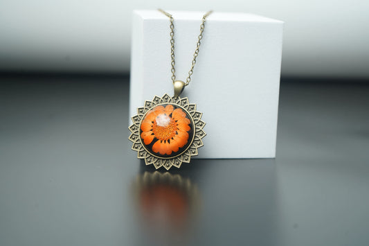 Orange Daisy Flower Encased in Antique Round Pendant
