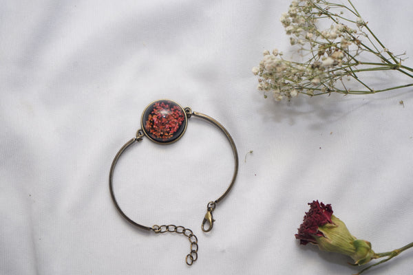 Red Real annes flower with Black braclet