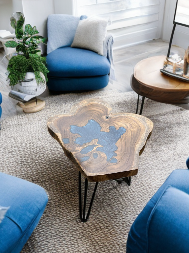 Live edge coffee table made from teak wood and blue epoxy resin, custom design in a modern Indian home setting.